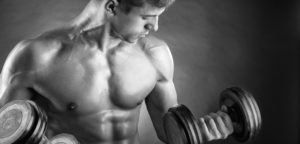 Close-up of a member training with dumbbells