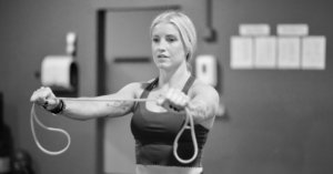Member performing a battle rope exercise as part of corrective training